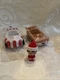 Elf on the Shelf Spin & Soar mini elf and two cars from the advent calendar