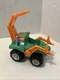Paw Patrol Dino Rescue Rocky Green Deluxe Rev Up Vehicle & Figure Spin Master