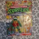 Playmates Toys Teenage Mutant Ninja Turtles Raphael with Storage Shell 2022