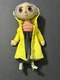 NECA Coraline Movie Prop Replica Doll Figure (heavy) in Yellow Rain Jacket 9"